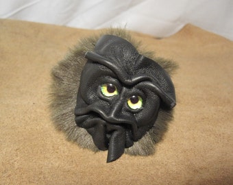 Grichels fake fur puffball keychain - black with green and yellow nova eyes