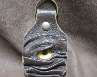 Grichels leather keychain - dark brown with orange eclipse eye