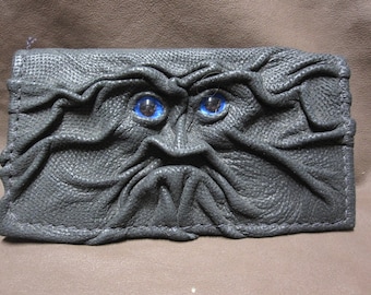 Grichels leather checkbook cover - scaly textured black with cobalt blue large pupil eyes