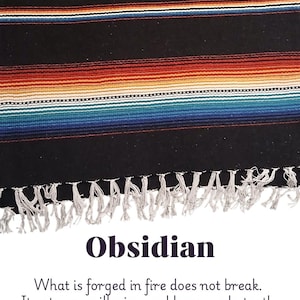 May include: A black woven textile with horizontal stripes in shades of red, orange, blue, and white. The bottom edge features a fringe. The word "Obsidian" is displayed below, along with text about truth.