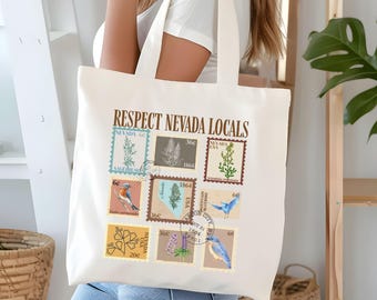 May include: Cream-coloured tote bag with a design of vintage postage stamps. The stamps feature Nevada flora and fauna, with the text "RESPECT NEVADA LOCALS." The stamps include images of birds and plants.