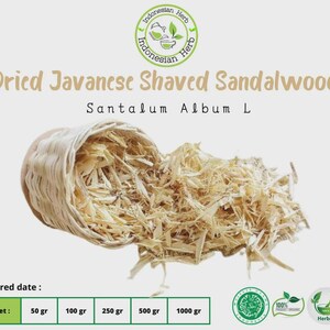 May include: A light-colored woven basket spilling out shaved sandalwood. The text reads "Dried Javanese Shaved Sandalwood" and "Santalum Album L". The image also includes a green and white Indonesian Herb logo and net weight options from 50 gr to 1000 gr.
