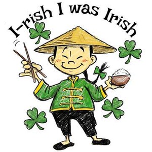May include: A cartoon illustration of a smiling person wearing a yellow conical hat and green jacket, holding chopsticks and a bowl of rice. The text "I-rish I was Irish" arches above the figure, with green shamrocks scattered around.