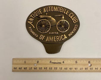 Placa con insignia de bronce del antiguo Automobile Club of America, 1935.