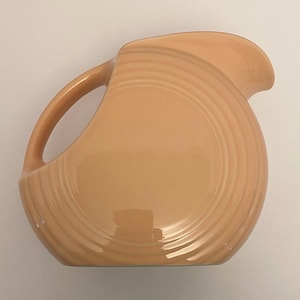 Vintage Retired Fiesta Homer Laughlin Peach Apricot Disc Pitcher Fiesta Ware.