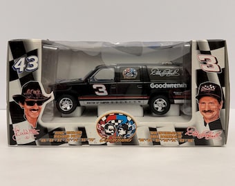 May include: A black die-cast model SUV with the number 3 on the side, displayed in a clear plastic box. The box features images of Richard Petty and Dale Earnhardt, with the text "Winston Cup Champion" and "Goodwrench".