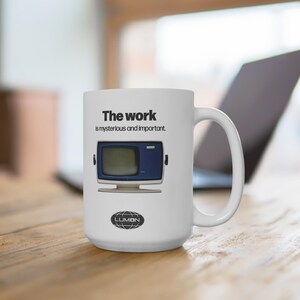 May include: White ceramic mug featuring a black and white image of a vintage computer screen with the text "The work is mysterious and important." The mug also has a black and white logo that says "LUMON".