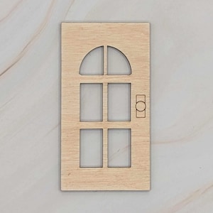 May include: A wooden door cutout with a six-pane window and a door knob. The door is unfinished and ready to be painted or stained.