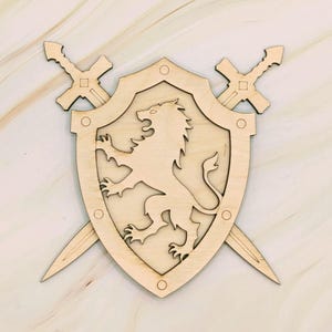 May include: A wooden shield with a lion emblem, flanked by two crossed swords. The shield is light brown with a detailed lion silhouette in the center. The swords are also light brown, with a cross-shaped hilt.