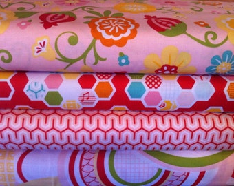 May include: Four different fabric swatches stacked on top of each other. The top swatch is pink with a floral pattern. The second swatch is white with red, orange, and blue honeycomb shapes. The third swatch is pink and white with a geometric pattern. The bottom swatch is pink with a white and green geometric pattern.