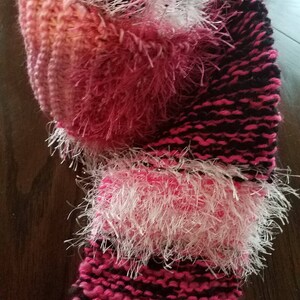Hand-knit scrappy scarf in pinks, white, and black