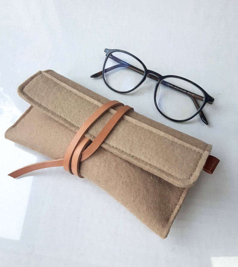 Soft wool felt case for reading glasses in toffee beige featuring a unique leather wrap closure