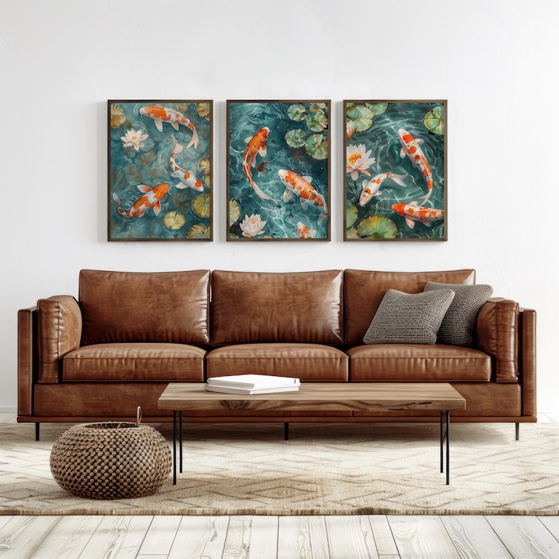 A koi pond painting displayed as a triptych wall art set above a white sofa. This elegant koi fish print adds a peaceful and sophisticated touch to a modern living room.