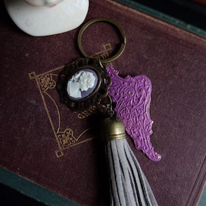 Purple Lace Wing and Gray Leather Tassel and Lady Cameo Keychain