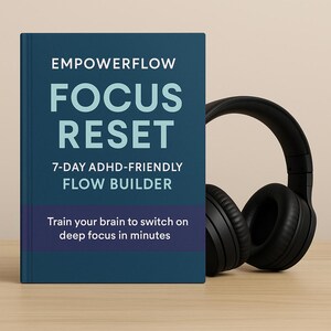 May include: A book titled "EMPOWERFLOW FOCUS RESET" with the subtitle "7-DAY ADHD-FRIENDLY FLOW BUILDER" and the text "Train your brain to switch on deep focus in minutes." Black over-ear headphones are next to the book.