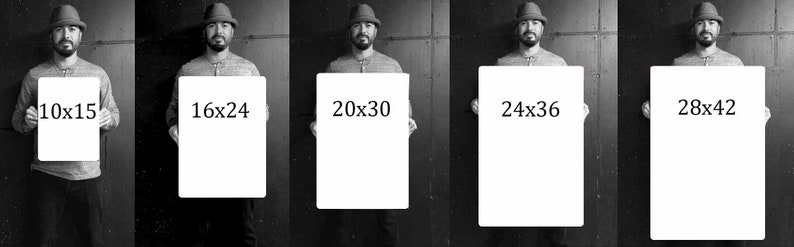 May include: Five different sizes of blank canvases are held by a person wearing a hat. The canvases are labeled with their dimensions in inches: 10x15, 16x24, 20x30, 24x36, and 28x42.