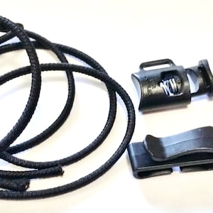 May include: Black elastic cord with two black plastic cord locks and two black plastic cord clips.