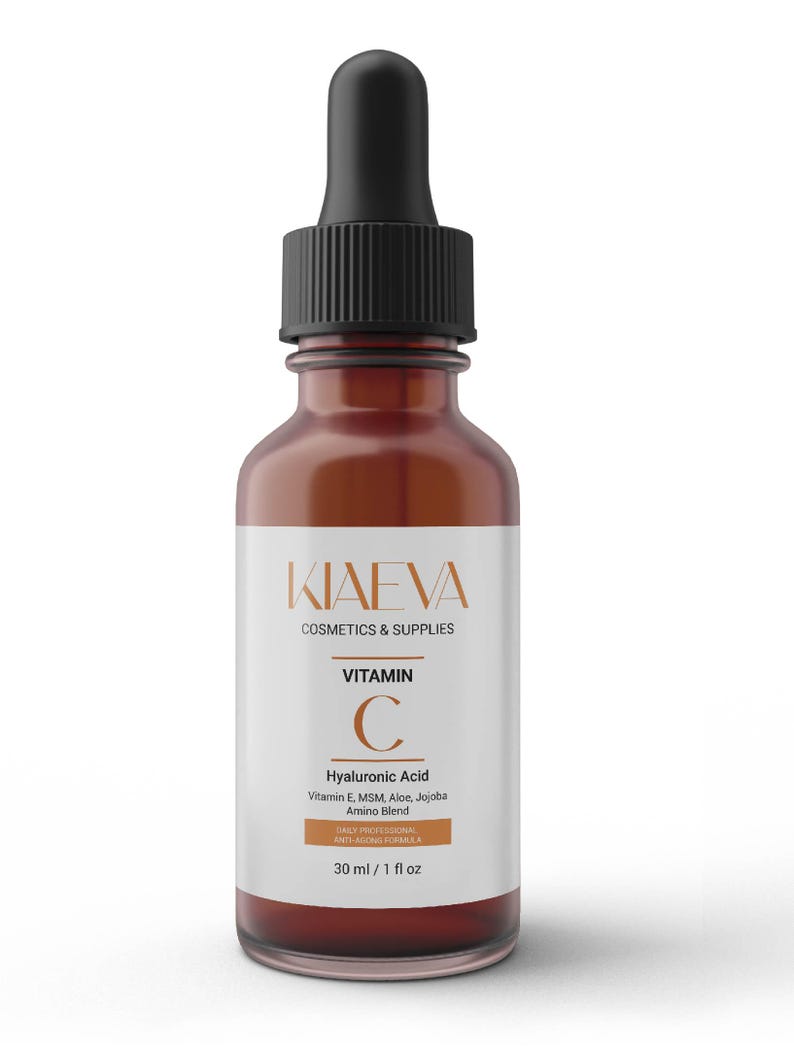 May include: A brown glass bottle with a black dropper, labeled "KIAEVA COSMETICS & SUPPLIES." The label highlights "Vitamin C" and "Hyaluronic Acid" with a blend of Vitamin E, MSM, Aloe, and Jojoba. The bottle contains 1 fl oz of product.
