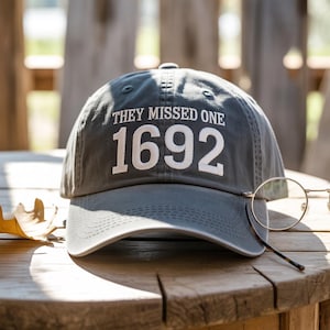 They Missed One 1692 Embroidered Hat – Funny Witch Trials Wash Hat or Baseball Cap, Salem Dark Humor Gift, Spooky Halloween Adjustable Hat