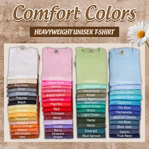 a variety of colorful t-shirts, each with a different color and design, arranged in a grid-like pattern.