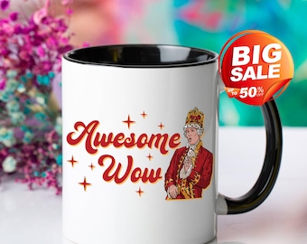 May include: White ceramic mug with a black interior and handle. The mug features the words "Awesome Wow" in red script with star accents, and an illustration of a person in a red coat and crown. A "Big Sale" sticker is attached.