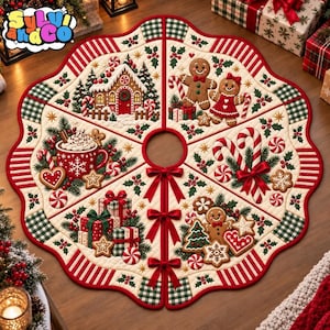 May include: A round, quilted Christmas tree skirt featuring a festive gingerbread theme. The design includes illustrations of a gingerbread house, gingerbread people, candy canes, wrapped gifts, and hot cocoa, accented with red and green plaid.