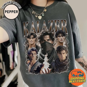 May include: Dark gray Comfort Colors t-shirt with the word "KAIZER" in a brown, textured font. The shirt features a graphic of a man with multiple images of his face, with lightning bolt accents.