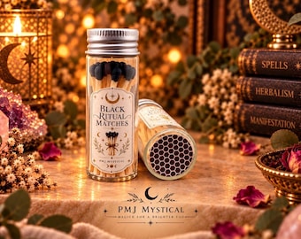 May include: A clear glass jar with a silver screw-top lid filled with wooden matches featuring black tips. The label reads Black Ritual Matches and PMJ Mystical. A second jar lies on its side, revealing a dark brown hexagonal strike pad.