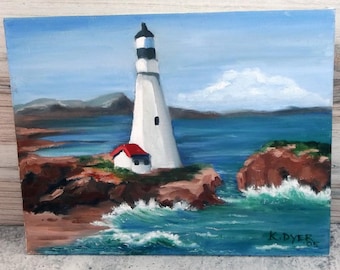Pintura acrílica sobre lienzo titulada Faro oceánico. Firmada por K.A. Dyer. 8 x 10 pulgadas. EB18.