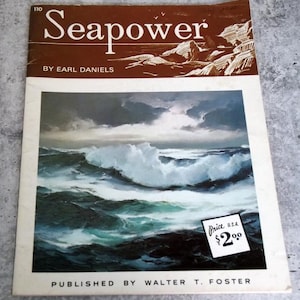 May include: Vintage "Seapower" book cover featuring a dramatic ocean wave painting under a cloudy sky. The title is in large, brown letters with the author's name, Earl Daniels, below. Published by Walter T. Foster. A price tag shows $2.00.