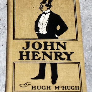 May include: A vintage book cover with a beige background and black text and illustrations. The title "JOHN HENRY" is displayed, with the author's name, "HUGH MCHUGH," below. The cover features a man in a tuxedo and top hat, smoking a cigar.