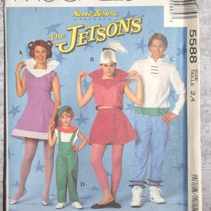 May include: A 1991 McCall's sewing pattern envelope for The Jetsons costumes, featuring illustrations of four outfits labeled A, B, C, and D. The blue background has star graphics, and the text includes Hanna-Barbera and pattern number 5588.