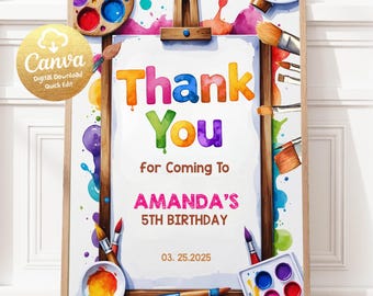 May include: A watercolor-style birthday party sign on a wooden easel. The sign reads "Thank You" in colorful letters, followed by "for Coming To AMANDA'S 5TH BIRTHDAY" and the date. Paintbrushes and palettes surround the sign.