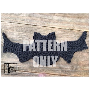 May include: A black crocheted bat pattern. The pattern is for a crocheted bat, and the text "PATTERN ONLY" is superimposed on the image.