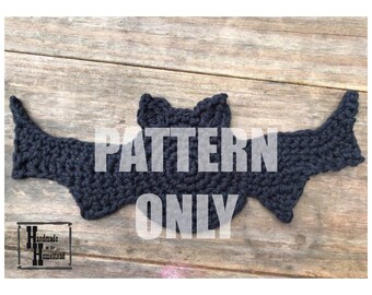 May include: A black crocheted bat pattern. The pattern is for a crocheted bat, and the text "PATTERN ONLY" is superimposed on the image.