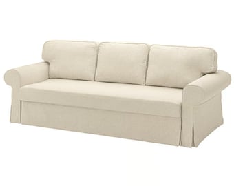 May include: A beige three-cushion sofa with rolled arms and a skirted base. The sofa has three back cushions and a neutral color scheme, suitable for various interior design styles.