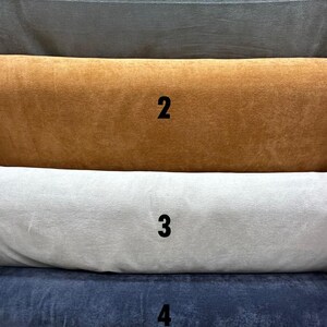 May include: Image showcasing five plush fabric samples in various colors. The samples are labeled with numbers and include shades of gray, brown, white, navy blue, and olive green. The text "Turkish Plush" is at the top.