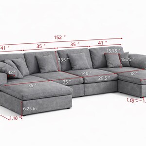 May include: A large, gray sectional sofa with multiple cushions and a chaise lounge. The sofa measures 152 inches long and 73.25 inches high. It includes several throw pillows and is designed for comfortable seating.
