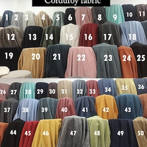 May include: A collection of corduroy fabric swatches in various colors, including shades of brown, black, green, pink, blue, and yellow. Each swatch is numbered for easy identification. The text "Corduroy fabric" is at the top.
