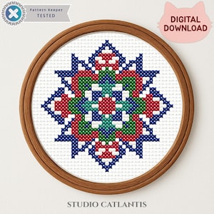 May include: A cross-stitch pattern in a wooden hoop. The design features a symmetrical, geometric pattern in red, green, blue, and white. The text "Pattern Keeper TESTED" and "DIGITAL DOWNLOAD" are visible.
