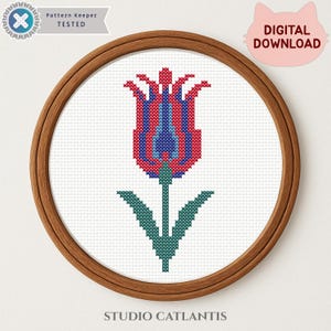 May include: A cross-stitch pattern of a tulip in a wooden embroidery hoop. The tulip design features red, blue, and green colors. The text "Pattern Keeper TESTED" and "DIGITAL DOWNLOAD" are visible. The text "STUDIO CATLANTIS" is at the bottom.
