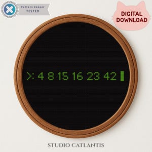 May include: A black cross-stitch design in a wooden hoop. The design features the numbers 4, 8, 15, 16, 23, and 42 in green. The text "DIGITAL DOWNLOAD" is in a pink cat-shaped bubble. The text "Pattern Keeper TESTED" is also visible.
