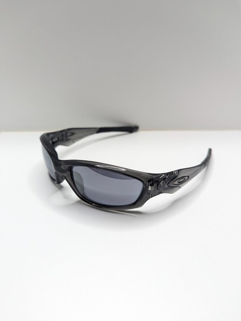 Gafas de sol Oakley Straight Jacket 04-327 para hombre, color gris humo y negro iridio. imagen 7