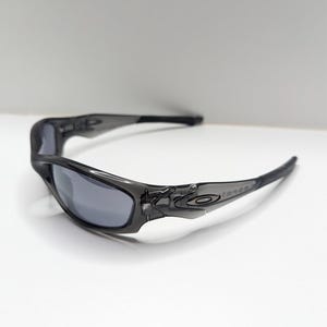 Gafas de sol Oakley Straight Jacket 04-327 para hombre, color gris humo y negro iridio. imagen 8