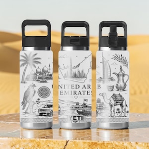 May include: Three white stainless steel water bottles with black lids, each featuring black line art illustrations of United Arab Emirates landmarks, a falcon, a camel, a dahlah coffee pot, and the text United Arab Emirates with a small heart.