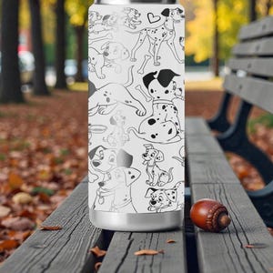 May include: A white stainless steel water bottle featuring a black and white Dalmatian dog pattern. The bottle has a silver base and a matching silver top. The design includes various poses of the dogs, bones, and hearts.