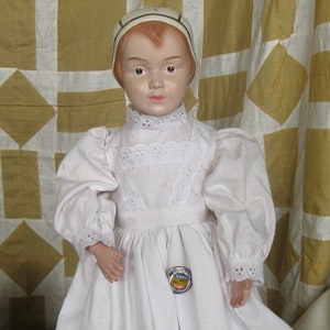 Schoenhut Reproduction USPS Stamp Doll Girl Doll With Schoenhut Pinback