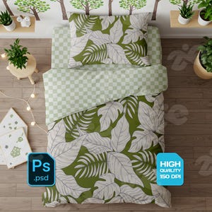 May include: A bed with a green and white leaf pattern duvet cover and pillow. The top sheet is a green and white checkered pattern. The image also includes decorative plants and a string of lights.