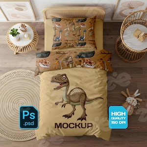 May include: Dinosaur-themed bedding set with a tan duvet cover featuring a cartoon dinosaur and the word "MOCKUP". The set includes a pillowcase with dinosaur illustrations and a matching bolster pillow. A rug and side table are also visible.