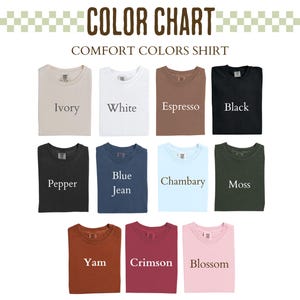 May include: A color chart displaying folded Comfort Colors shirts in various hues. The shirts are labeled with color names such as Ivory, White, Espresso, Black, Pepper, Blue Jean, Chambary, Moss, Yam, Crimson, and Blossom. The text "COLOR CHART" and "COMFORT COLORS SHIRT" are at the top.